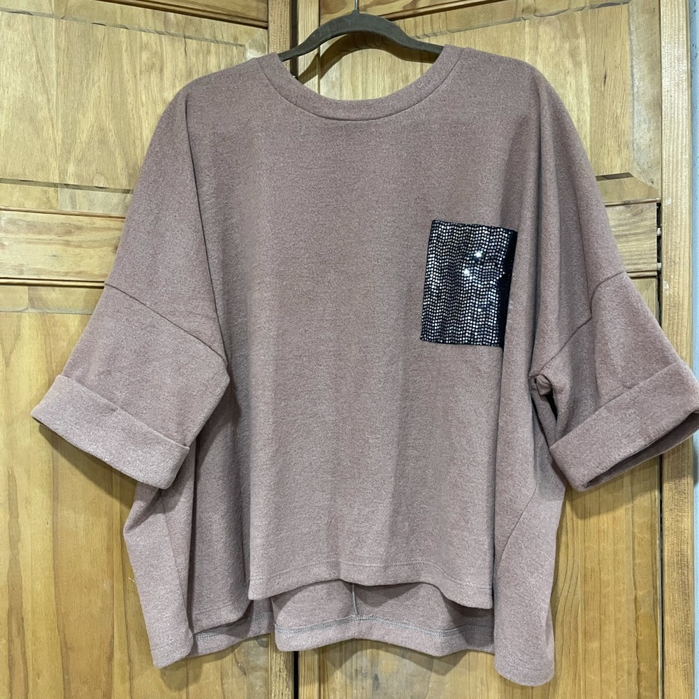 White Birch short-sleeve sweater with black sequined pocket.